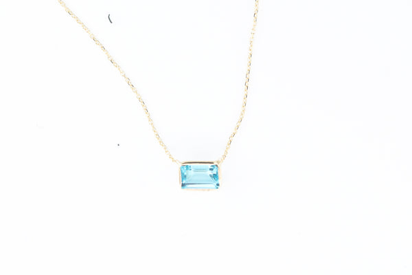 Yellow Gold Emerald Cut Bezel Set Blue Topaz Necklace