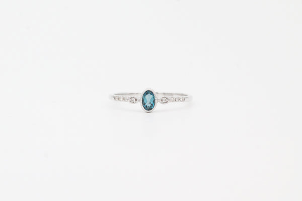 White Gold Oval Cut Bezel London Blue Topaz and Diamond Ring