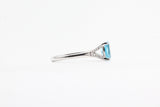 White Gold Blue Topaz Split Shank Ring