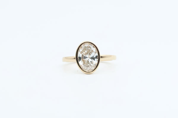 Yellow Gold Oval Lab Grown Diamond Bezel Set Engagement Ring