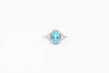 White Gold Oval Blue Topaz and Diamond Split Shank Halo Ring
