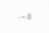 White Gold Oval Blue Topaz and Diamond Split Shank Halo Ring