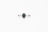 White Gold Oval Sapphire and Diamond Halo Ring with Twisted Band
